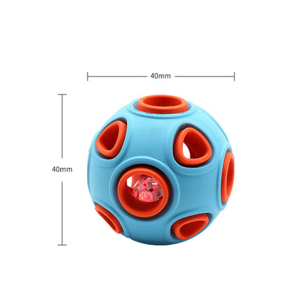 Illuminated Glow-in-the-Dark Squeaky Dog Ball glowing brightly in dark grass
