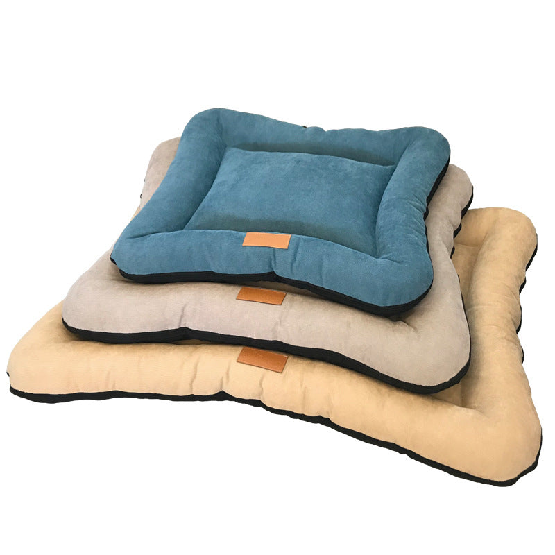 Washable nest pad bed in blue on hardwood floor