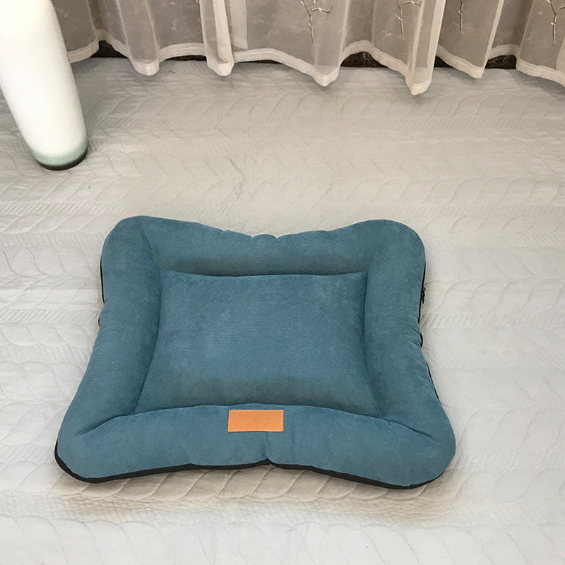 Small dog resting head on washable nest pad bed