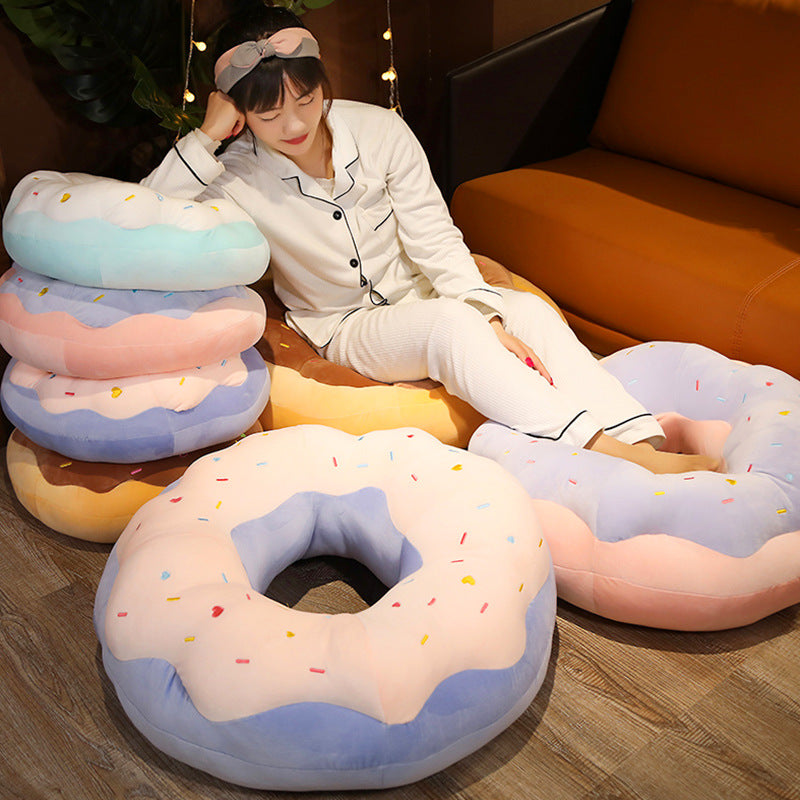 Donut plush cushion in sea salt blue on chair