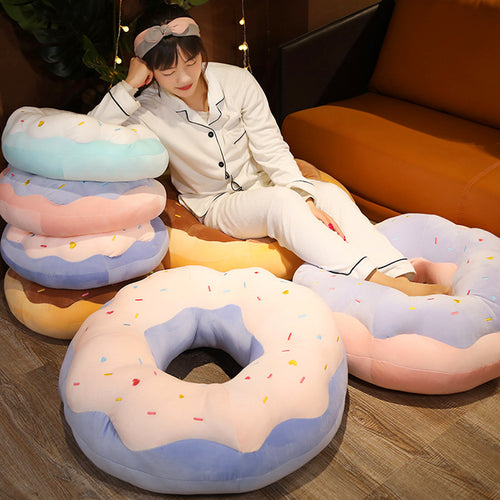 Donut plush cushion in sea salt blue on chair