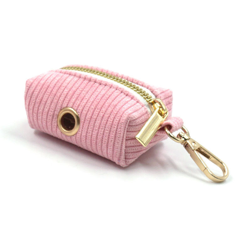 Compact corduroy blush pink pouch for carrying dog waste bags on walks