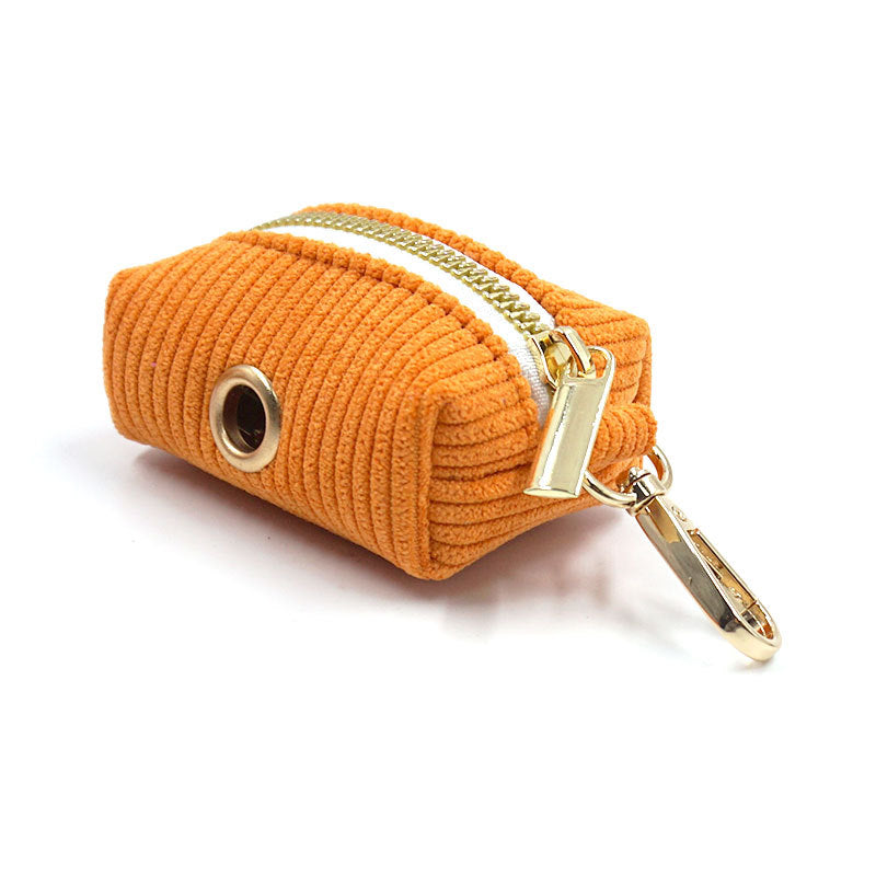 Compact corduroy orange pouch for carrying dog waste bags on walks