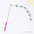 Solid wood cat teaser wand with long handle and natural plush flower attachment